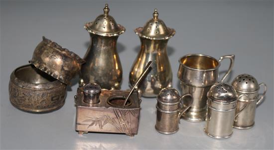 Five silver condiments, two silver napkin rings, a small silver cup and a Japanese silver condiment.